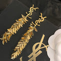 Saint Laurent YSL Leaf Tassel Gold Earrings