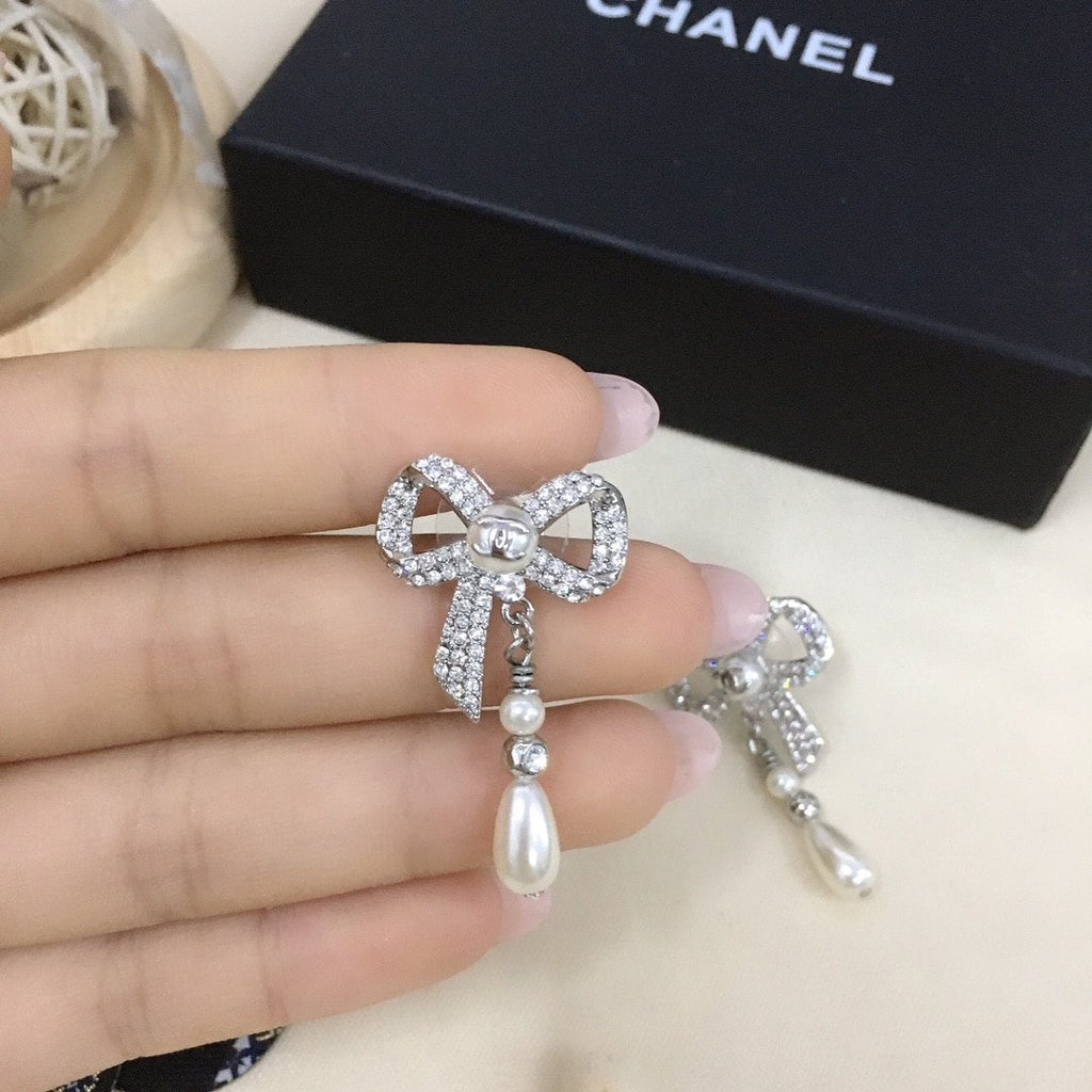 Chanel Bow Silver Pearl Earrings