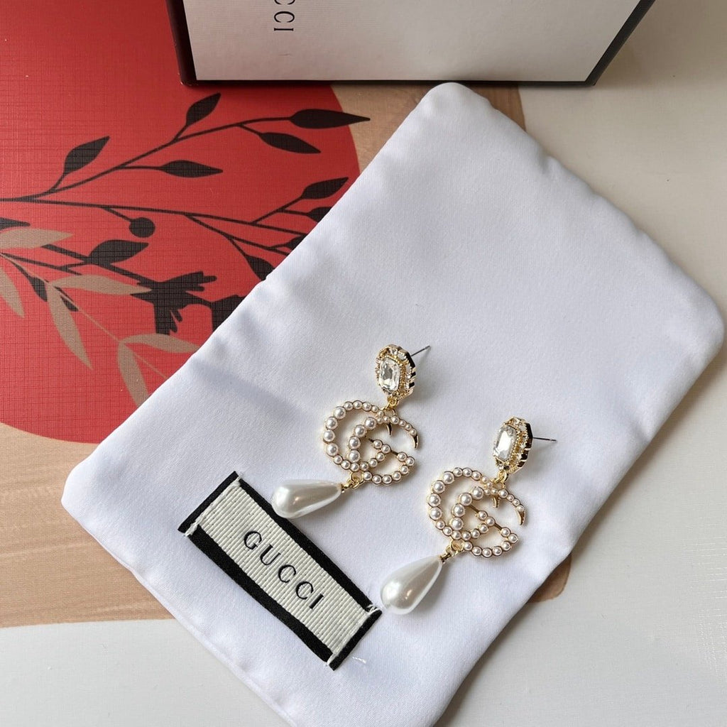 Gucci Pearl Gg Drop Earrings In Gold