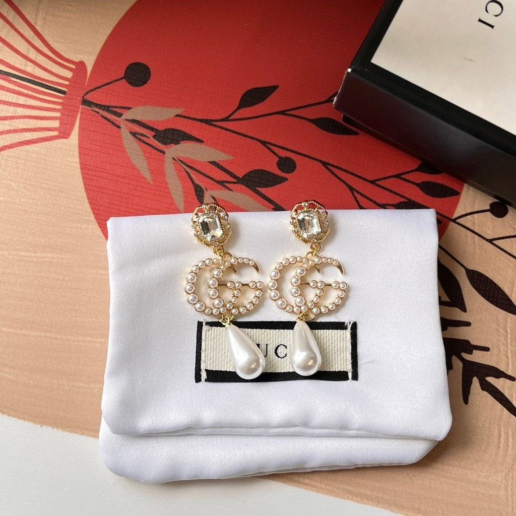 Gucci Pearl Gg Drop Earrings In Gold
