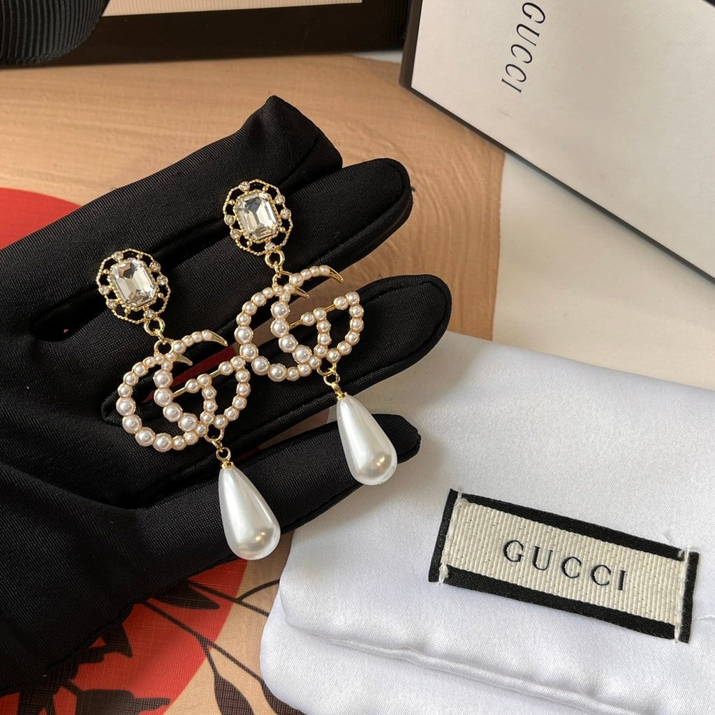 Gucci Pearl Gg Drop Earrings In Gold