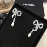 Chanel Bow Silver Pearl Earrings