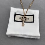 Gucci Gg Crystal Key In Gold Necklace