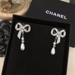 Chanel Bow Silver Pearl Earrings