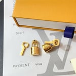 Louis Vuitton Lock It Earrings Gold