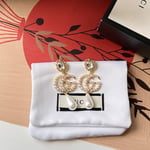 Gucci Pearl Gg Drop Earrings In Gold