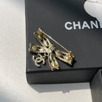 Chanel Cc Bowtie Brooch Gold