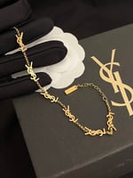 Saint Laurent Cassandre Bracelet Gold Tone