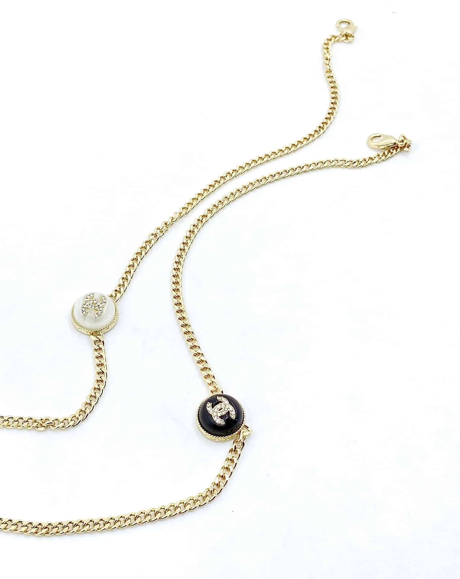 Chanel Logo Cc Necklace In Gold Metal Black Resin